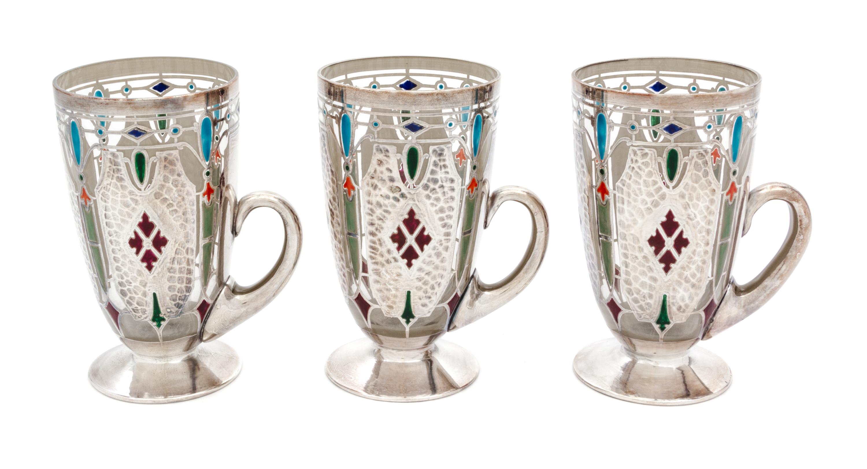 Three Art Nouveau Enameled and Silver Overlay Glass Mugs Height 5 1/4 inches.