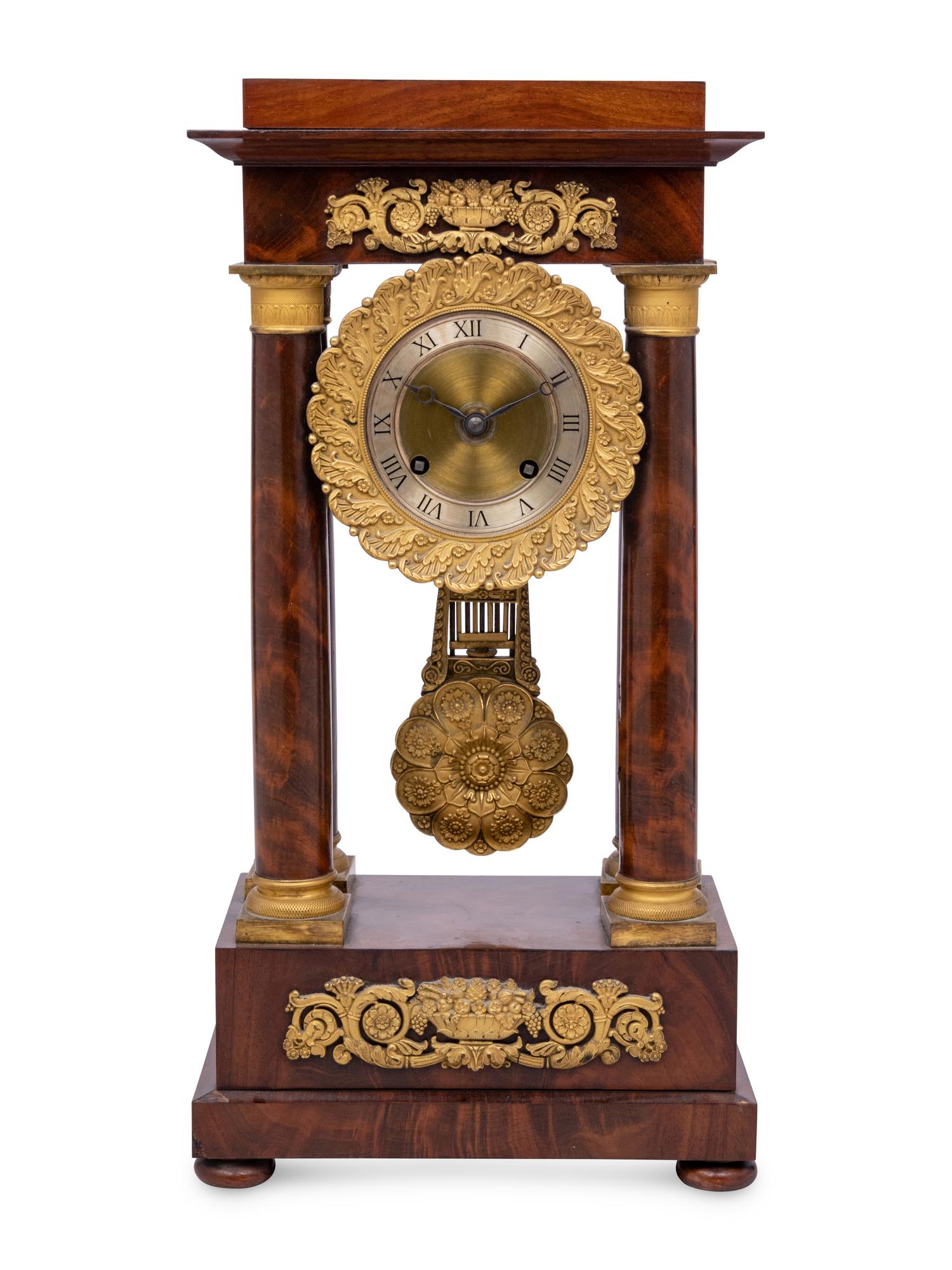 A Charles X Gilt Bronze Mounted Mahogany Portico Clock