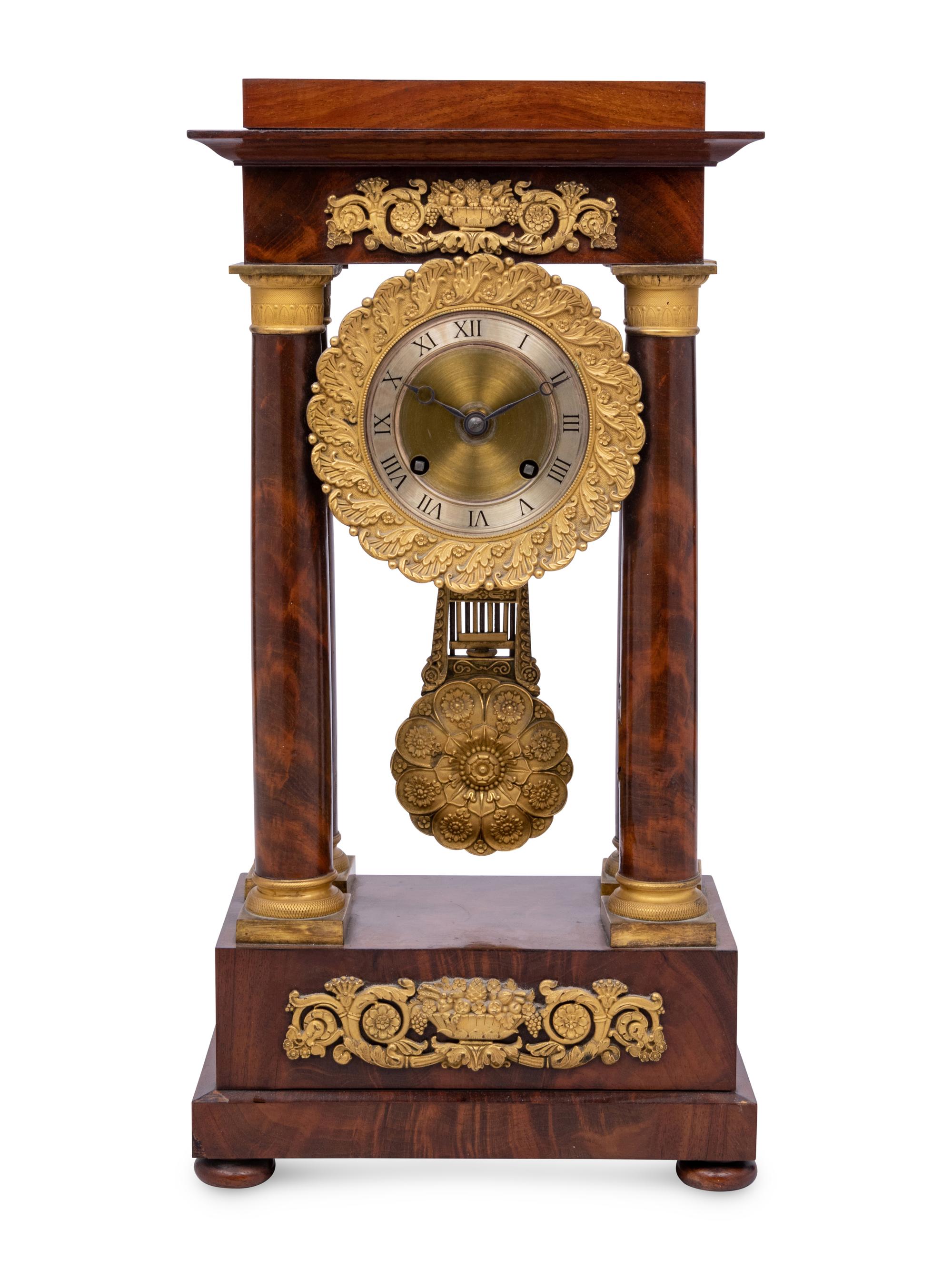 A Charles X Gilt Bronze Mounted Mahogany Portico Clock