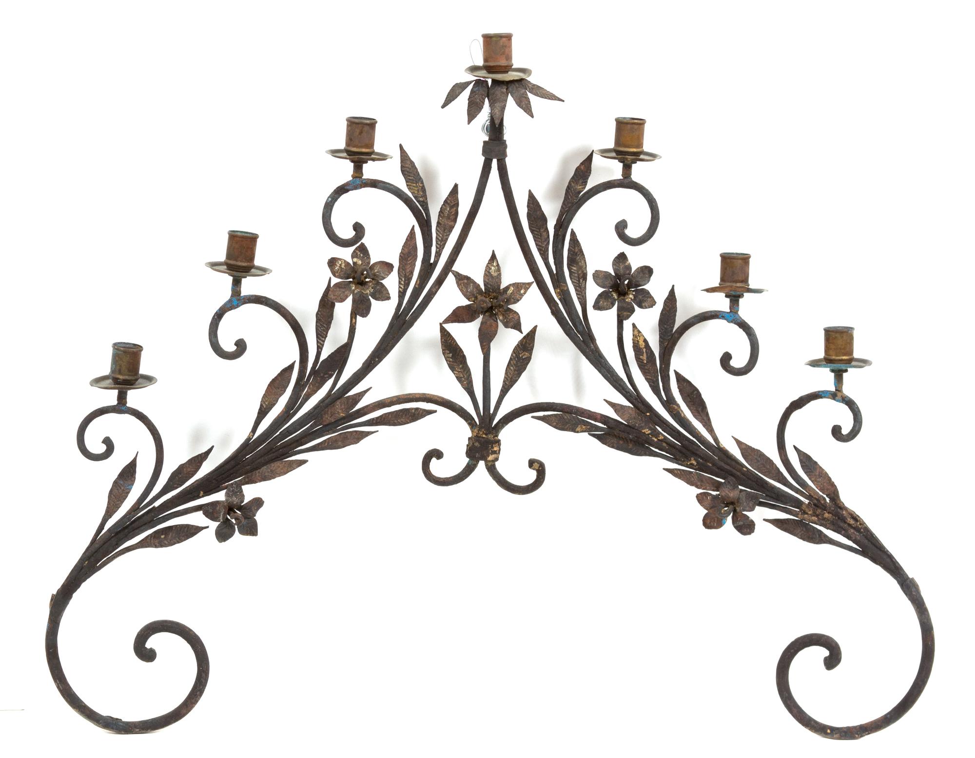 A Continental Wrought Iron Seven-Light Wall Sconce Height 26 x width 30 1/2 inches. — 19TH CENTURY