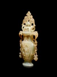 A Carved Serpentine Vase and Cover