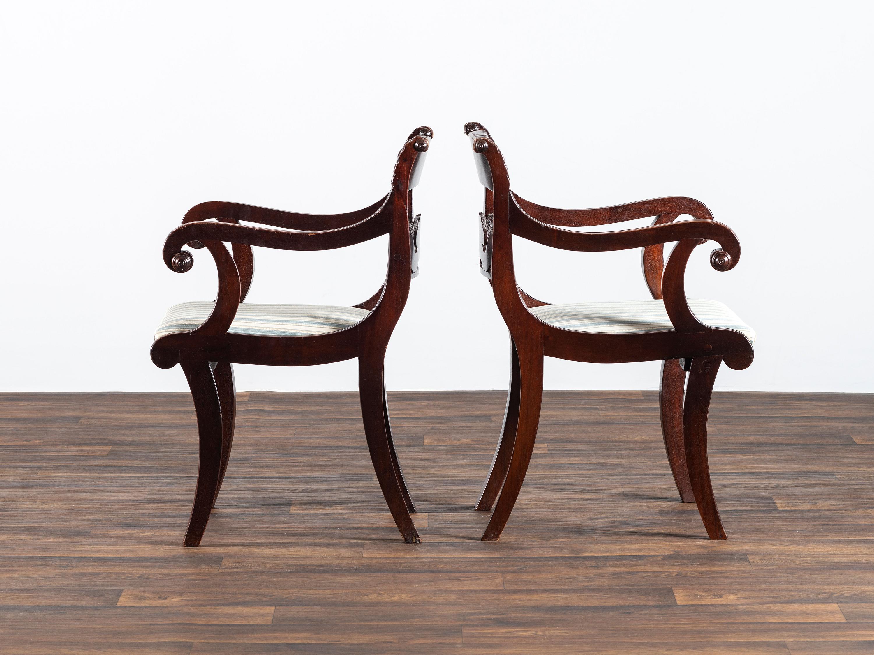 A Pair of Classical Cornucopia Carved Mahogany Armchairs