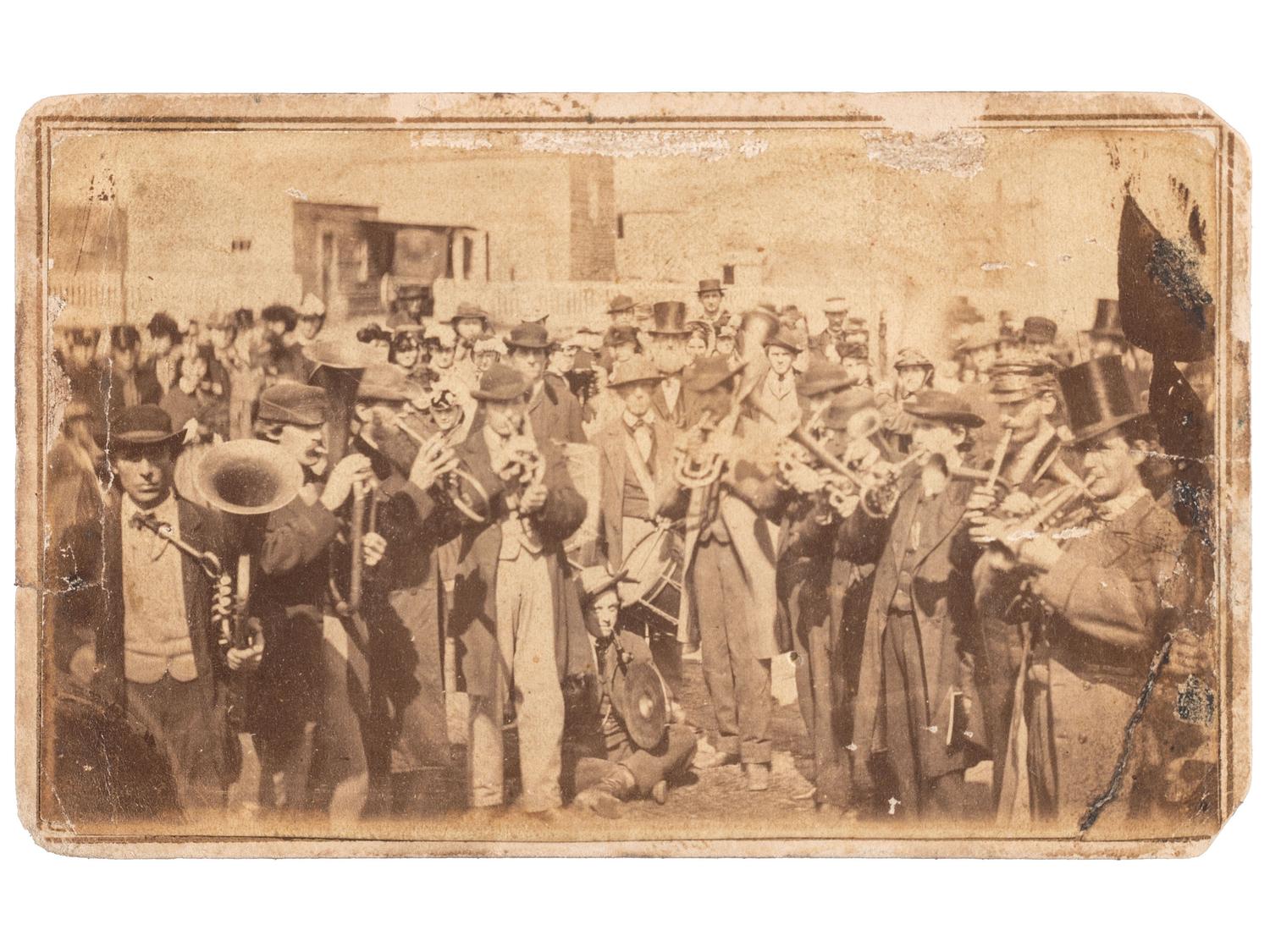 [CIVIL WAR]. CAMPBELL, G.W., photographer. CDV of jubilant musicians celebrating the fall of Richmond. Ca 1865.