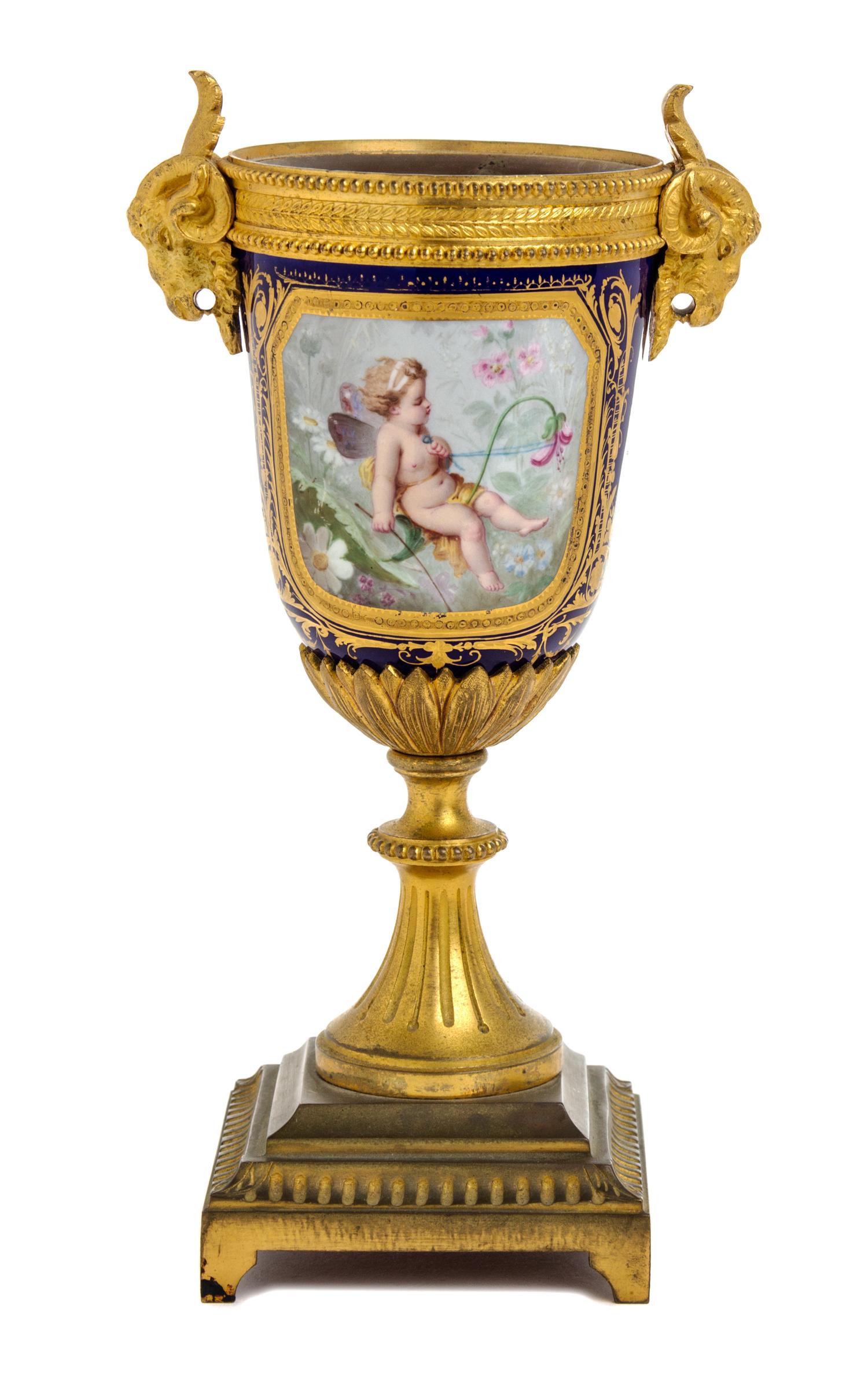 A Sevres Style Gilt Bronze Mounted Porcelain Urn Height 8 5/8 inches. — 19TH CENTURY