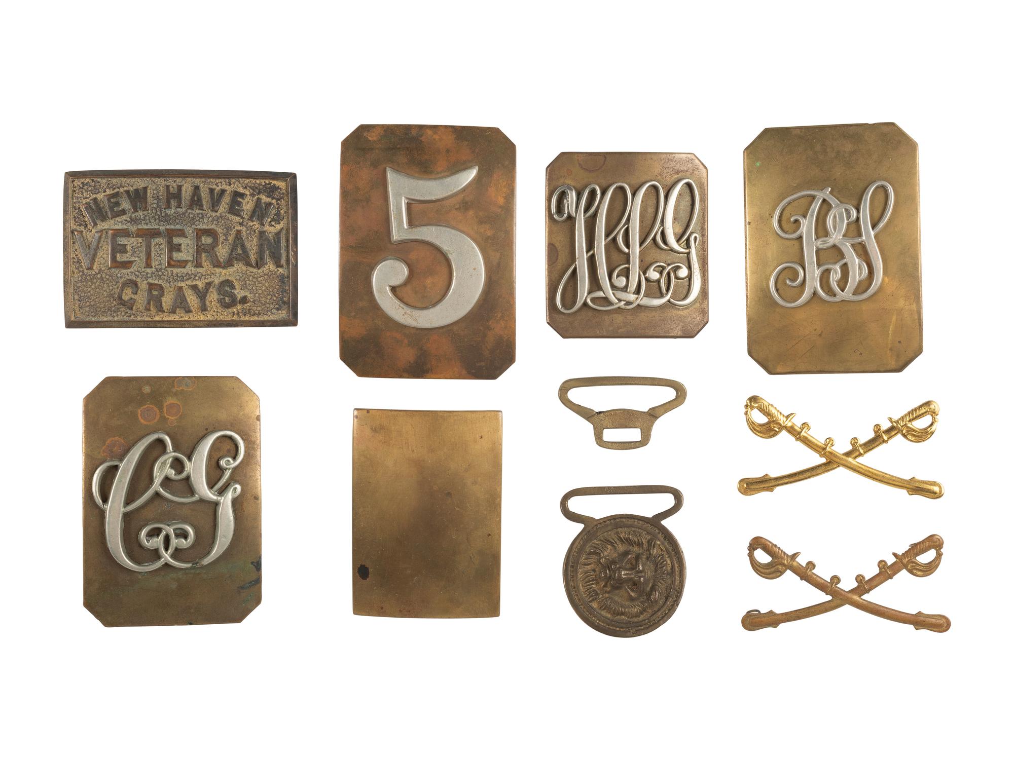 [MILITARIA]. A collection of post-war belt plates and insignia, comprising: