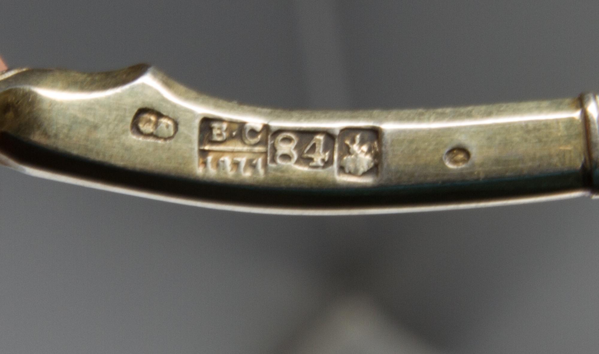 A Group of Four Russian Niello Silver Spoons, Various makers, Moscow, 19th century, each having a twist stem, the undersides with scene