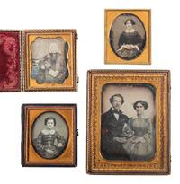 [EARLY PHOTOGRAPHY]. 4 daguerreotypes featuring women with religious symbols.