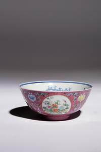 A Ruby Sgraffito Ground Famille Rose and Underglaze Blue Porcelain Bowl