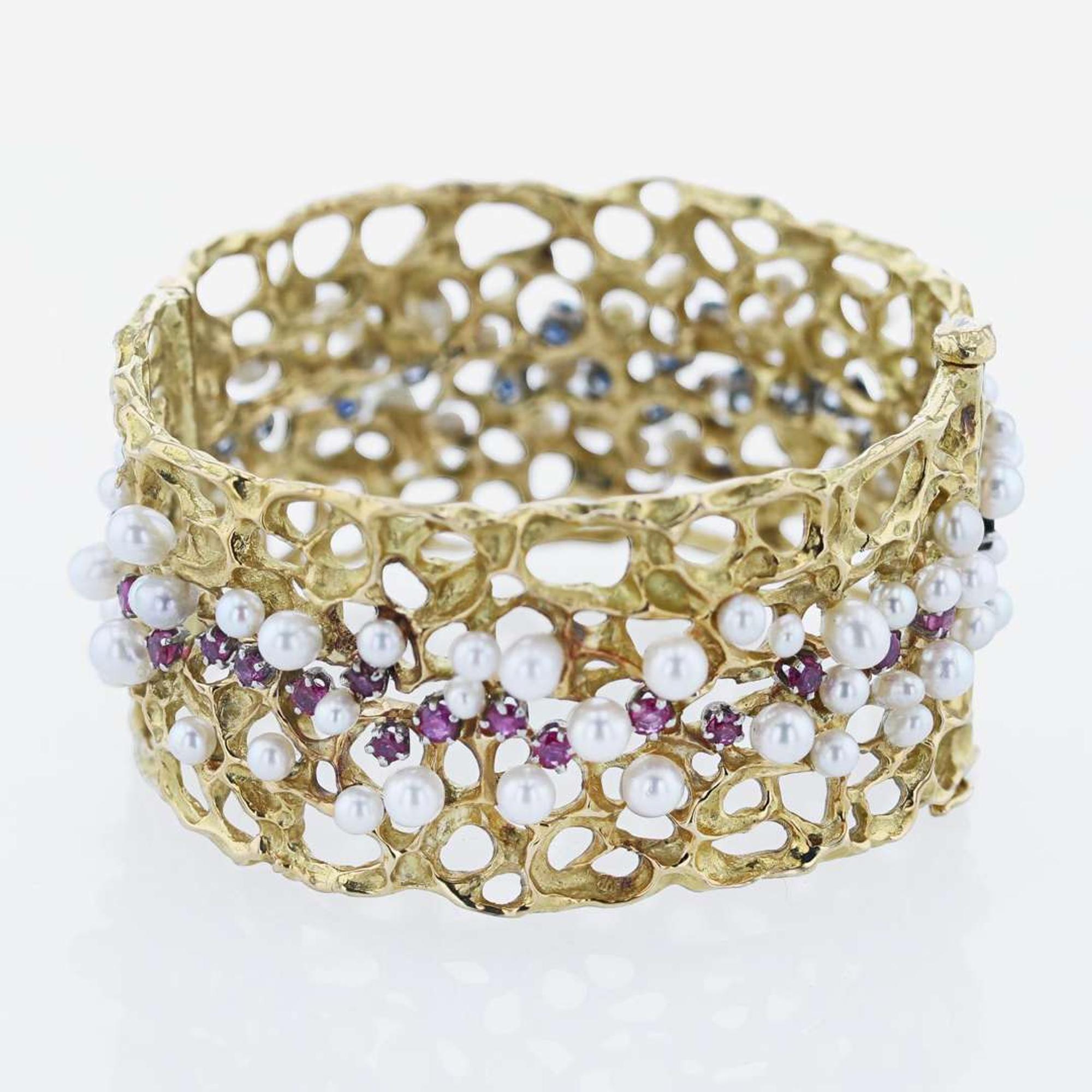 An 18K Yellow Gold and Gemstone Bangle by Karl Stittgen