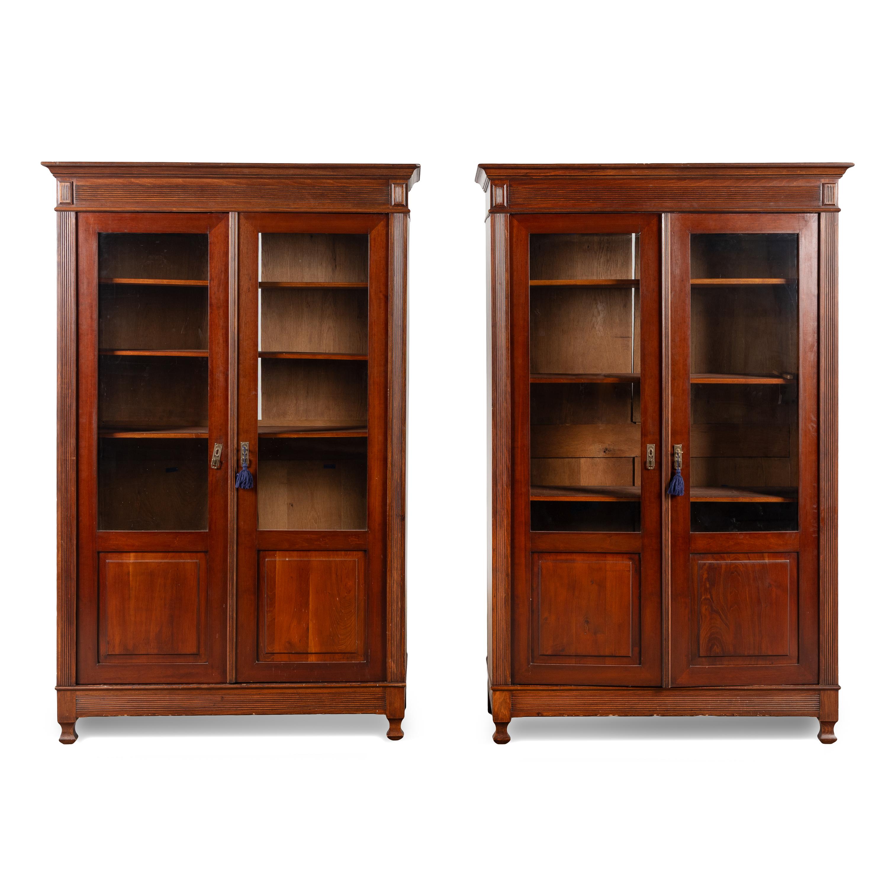 A Pair of English Mahogany Bookcase Cabinets