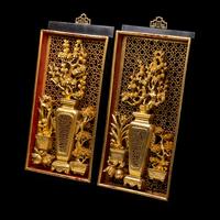A Matched Pair of Chinese Gilt and Red Lacquered Wood Panels