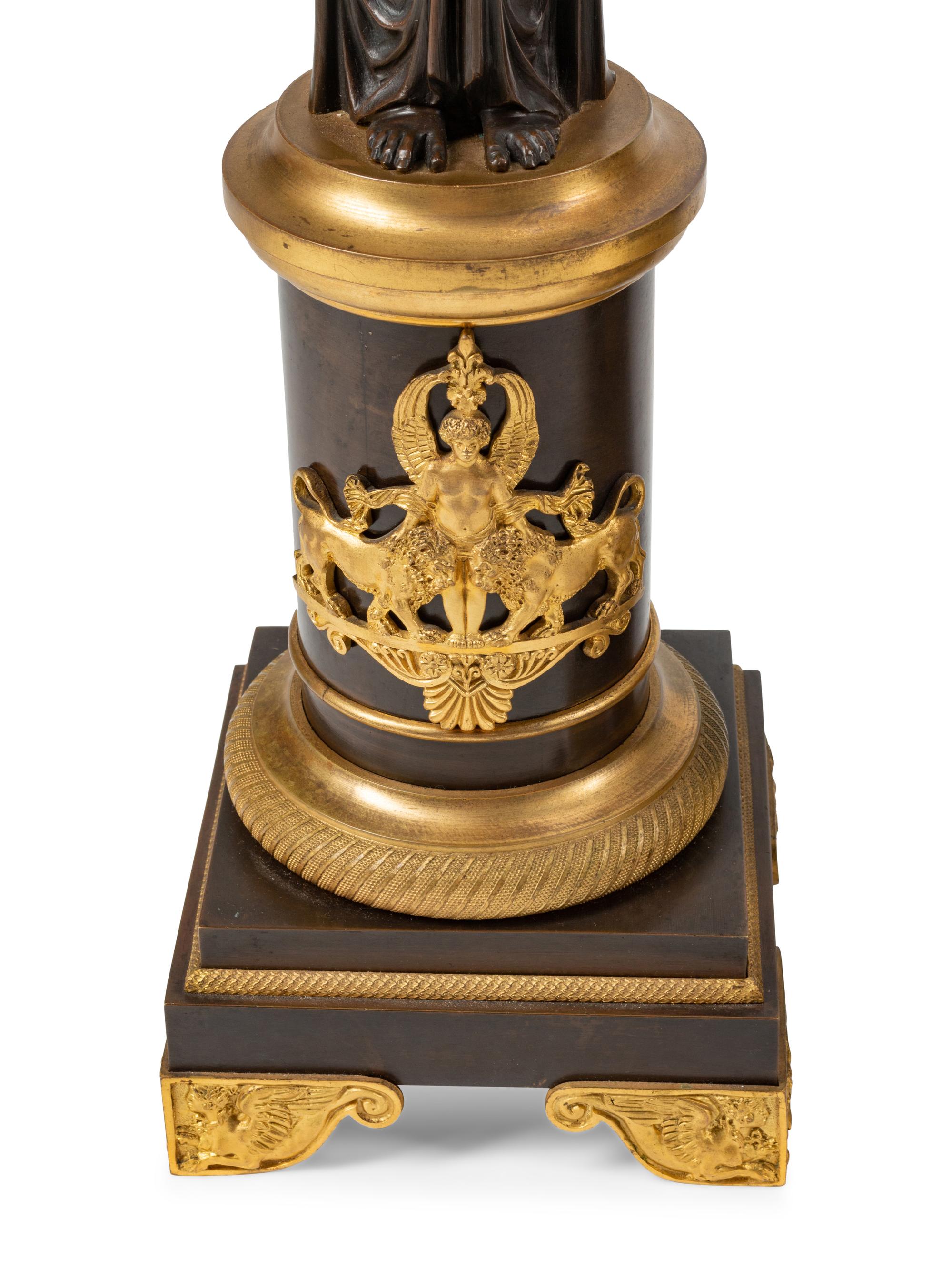 A Large Empire Style Gilt and Patinated Bronze Clock Garniture