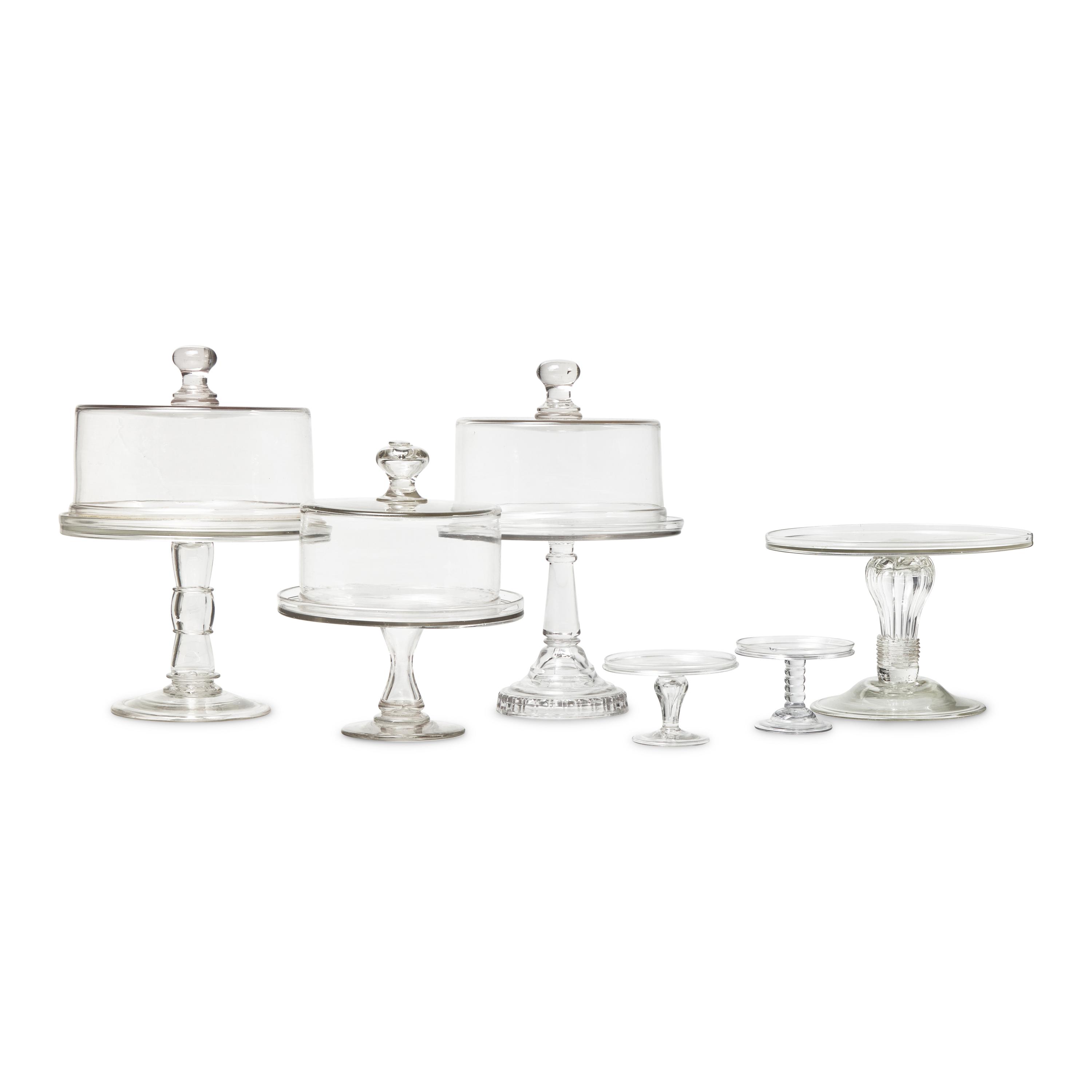 A Group of Nine Blown and Cast Glass Footed Cake Plates and Covers