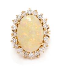 A 14 Karat Yellow Gold, Opal and Diamond Ring, Pacific Gem Co., 5.90 dwts.