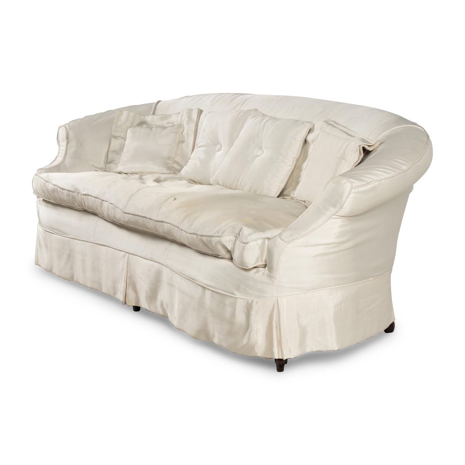 A Cream Silk-Slipcovered Reniform Sofa