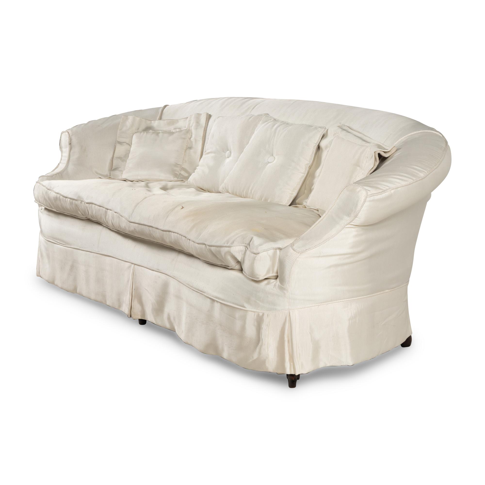 A Cream Silk-Slipcovered Reniform Sofa