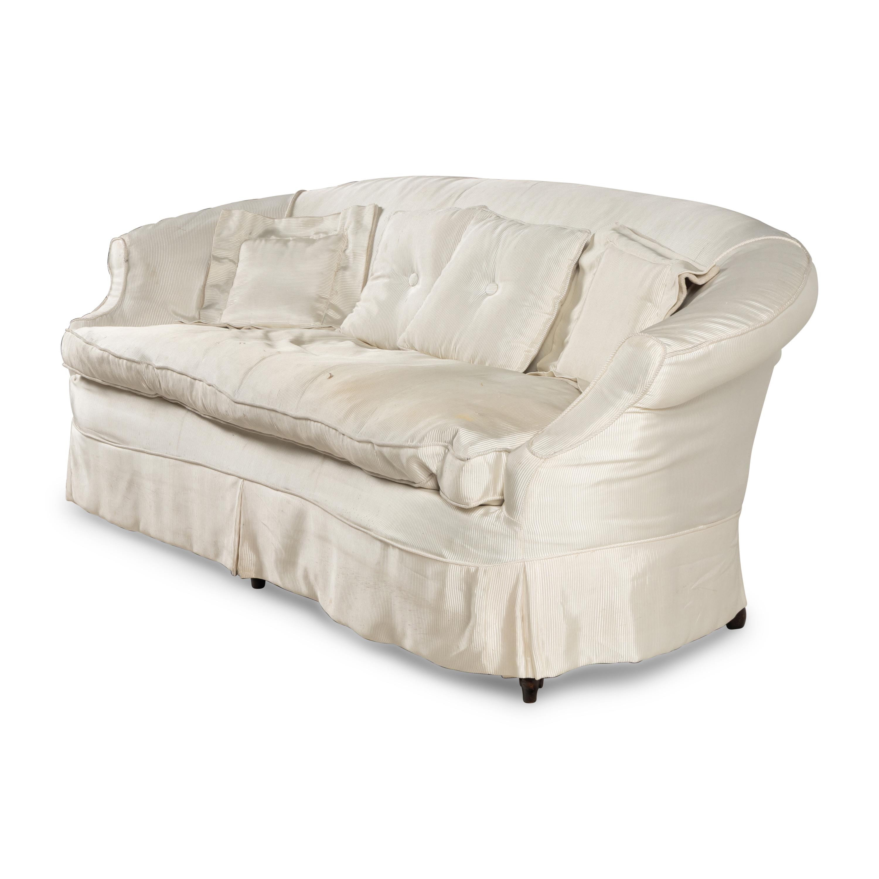 A Cream Silk-Slipcovered Reniform Sofa