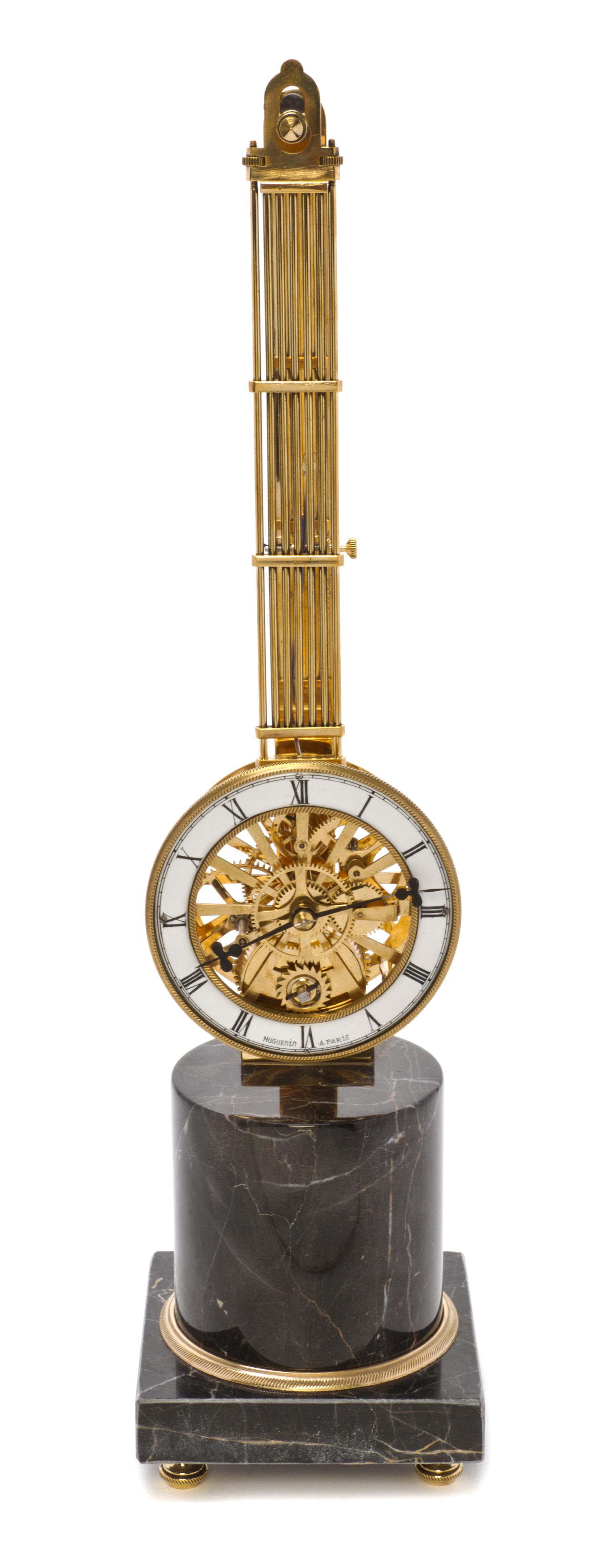 A French Brass and Marble Pendulum Clock, Height 20 inches.