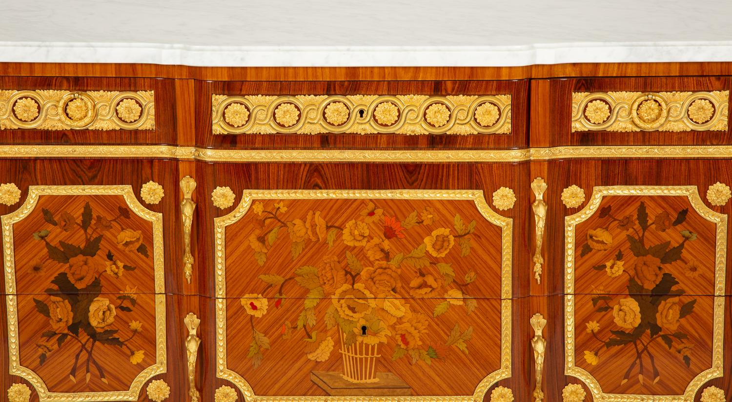 A Pair of Louis XV/XVI Transitional Style Gilt Bronze Mounted Marquetry Marble-Top Commodes