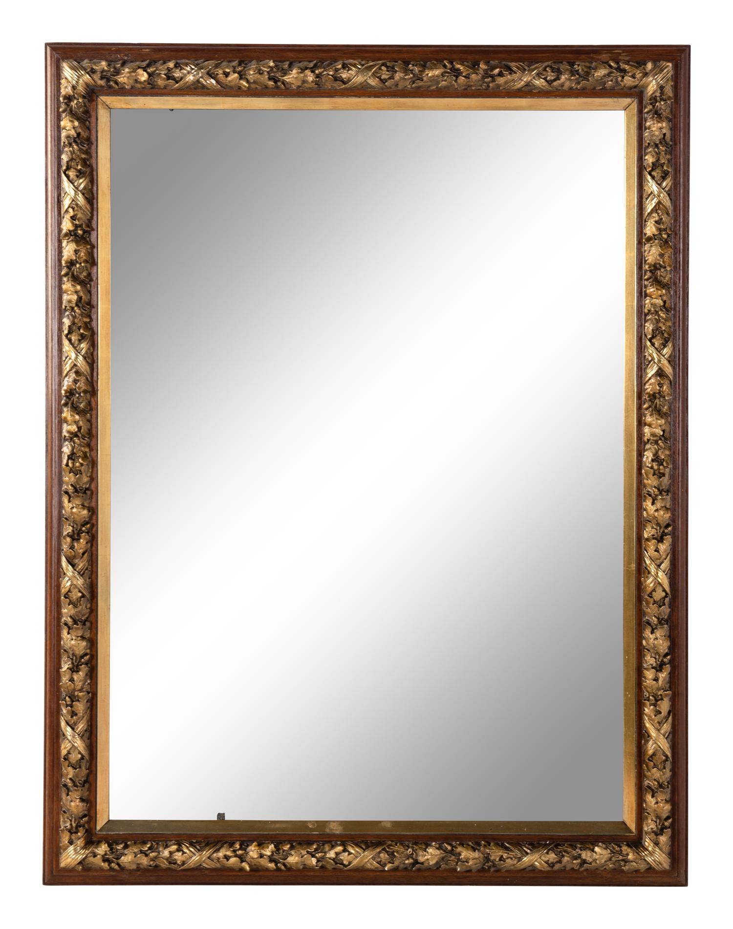 A French Carved and Parcel-Gilt Walnut Mirror