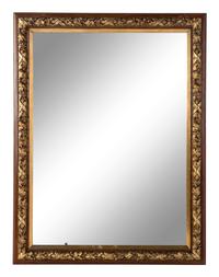 A French Carved and Parcel-Gilt Walnut Mirror