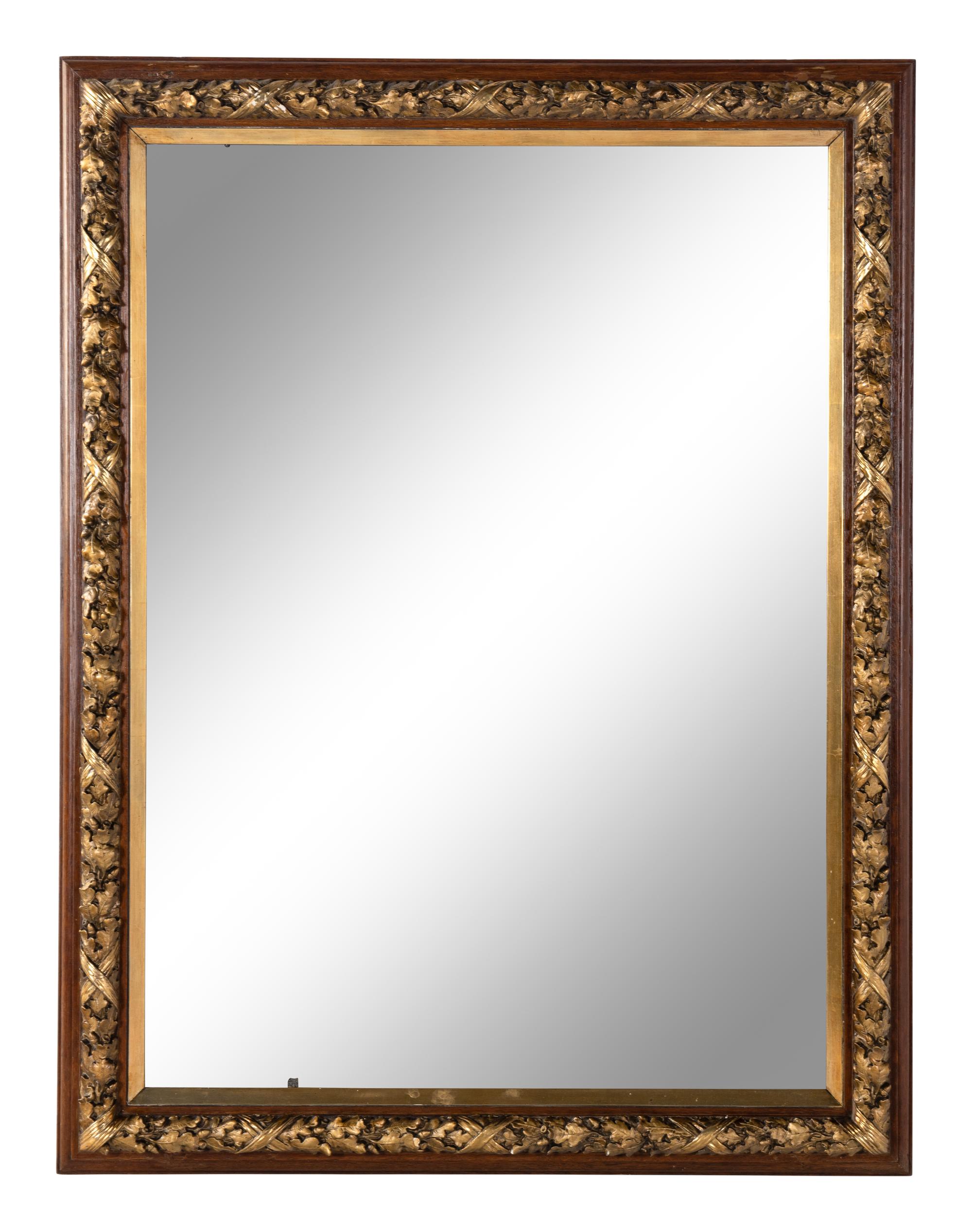 A French Carved and Parcel-Gilt Walnut Mirror