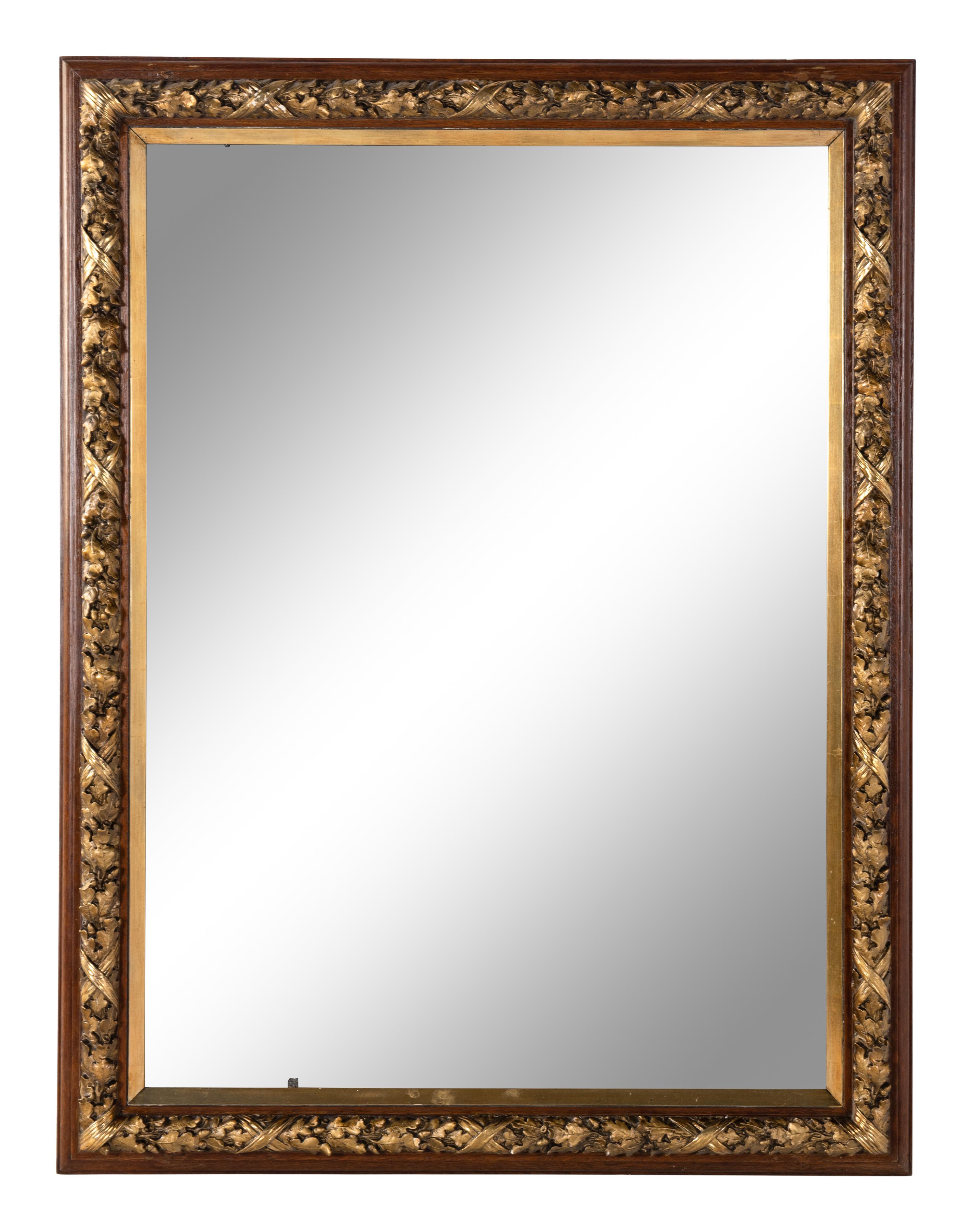 A French Carved and Parcel-Gilt Walnut Mirror