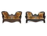 Two Similar Anglo-Burmese Carved Teak Settees