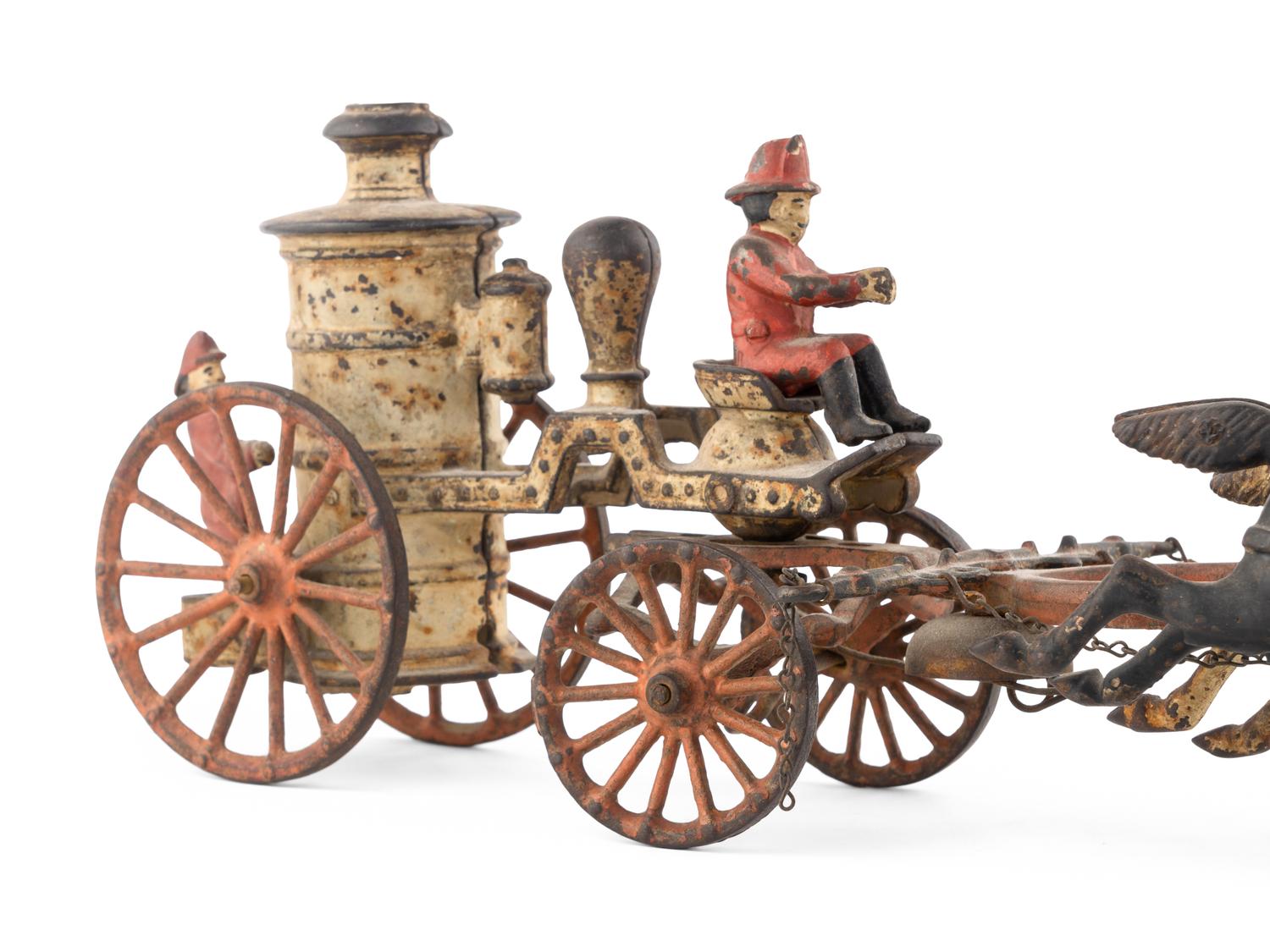 A Cast Iron Fire Engine Three-Horse Train and a Horse Pull Toy