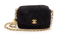 A Chanel Black Quilted Suede Bag, 6 1/2 x 4 1/2 x 2 1/2 inches.
