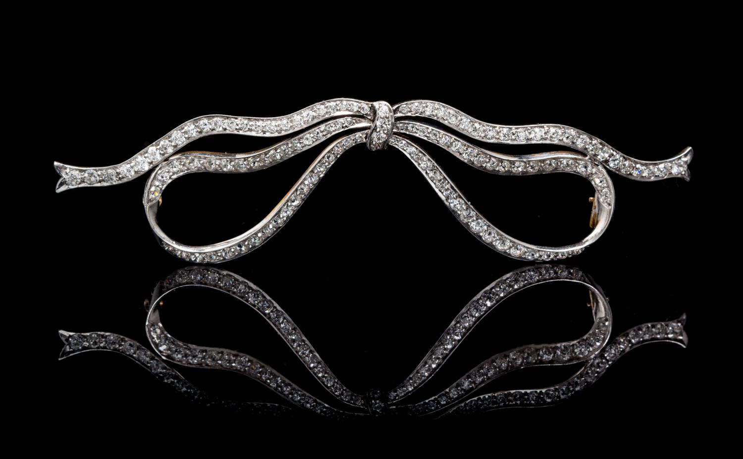 An Edwardian Platinum Topped Gold and Diamond Bow Brooch, 9.10 dwts.