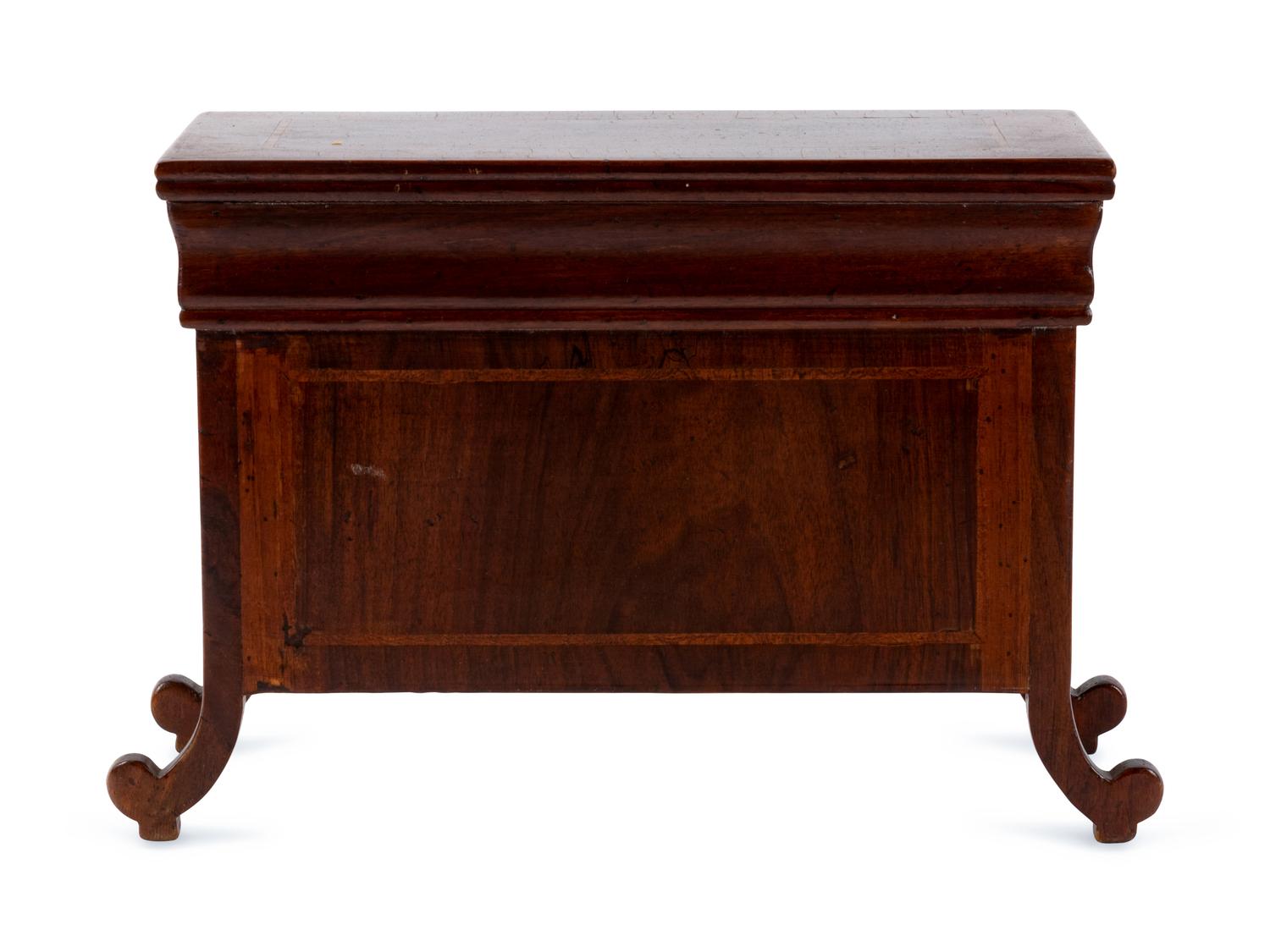 An Italian Walnut Diminutive Chest