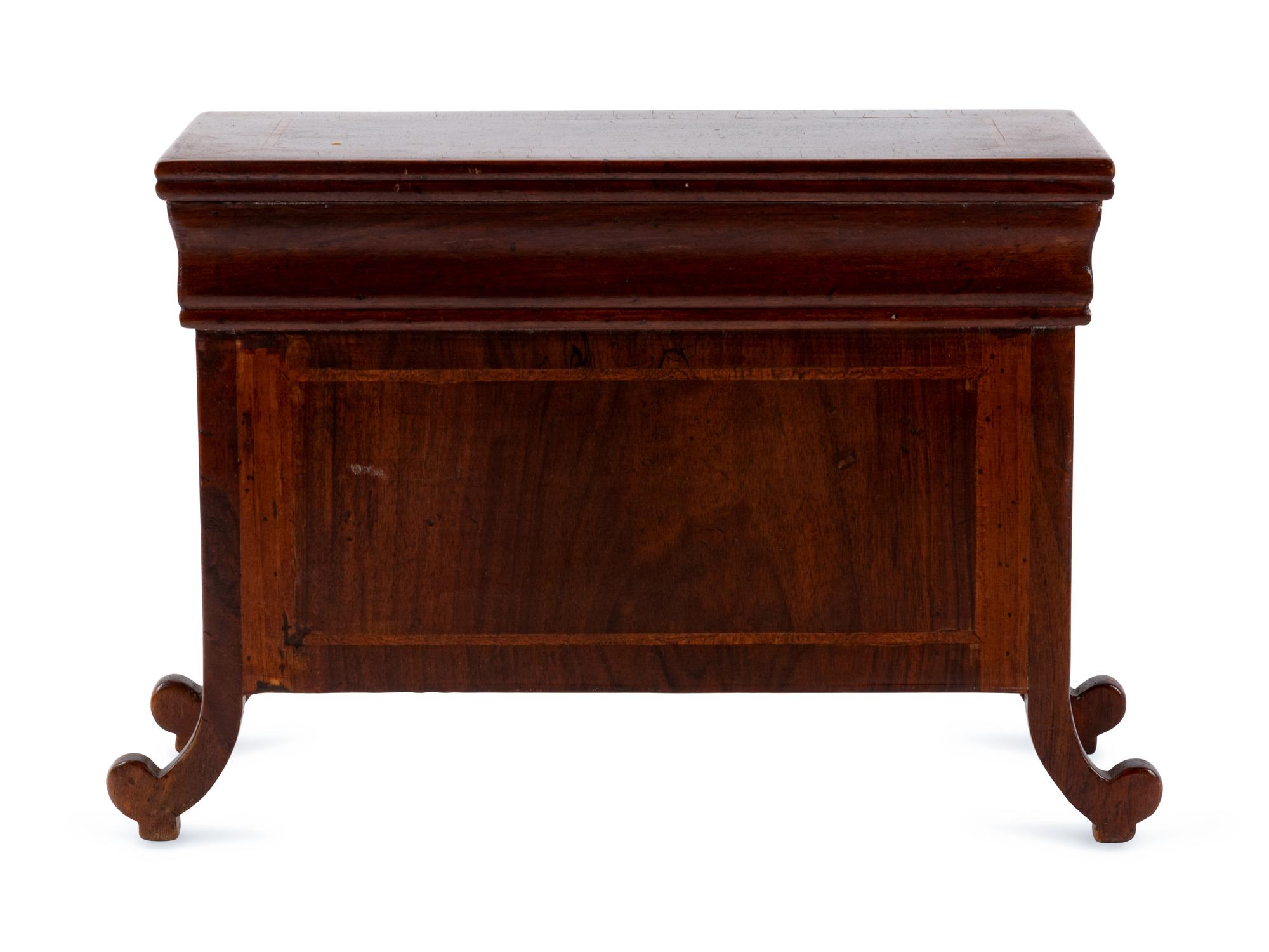 An Italian Walnut Diminutive Chest