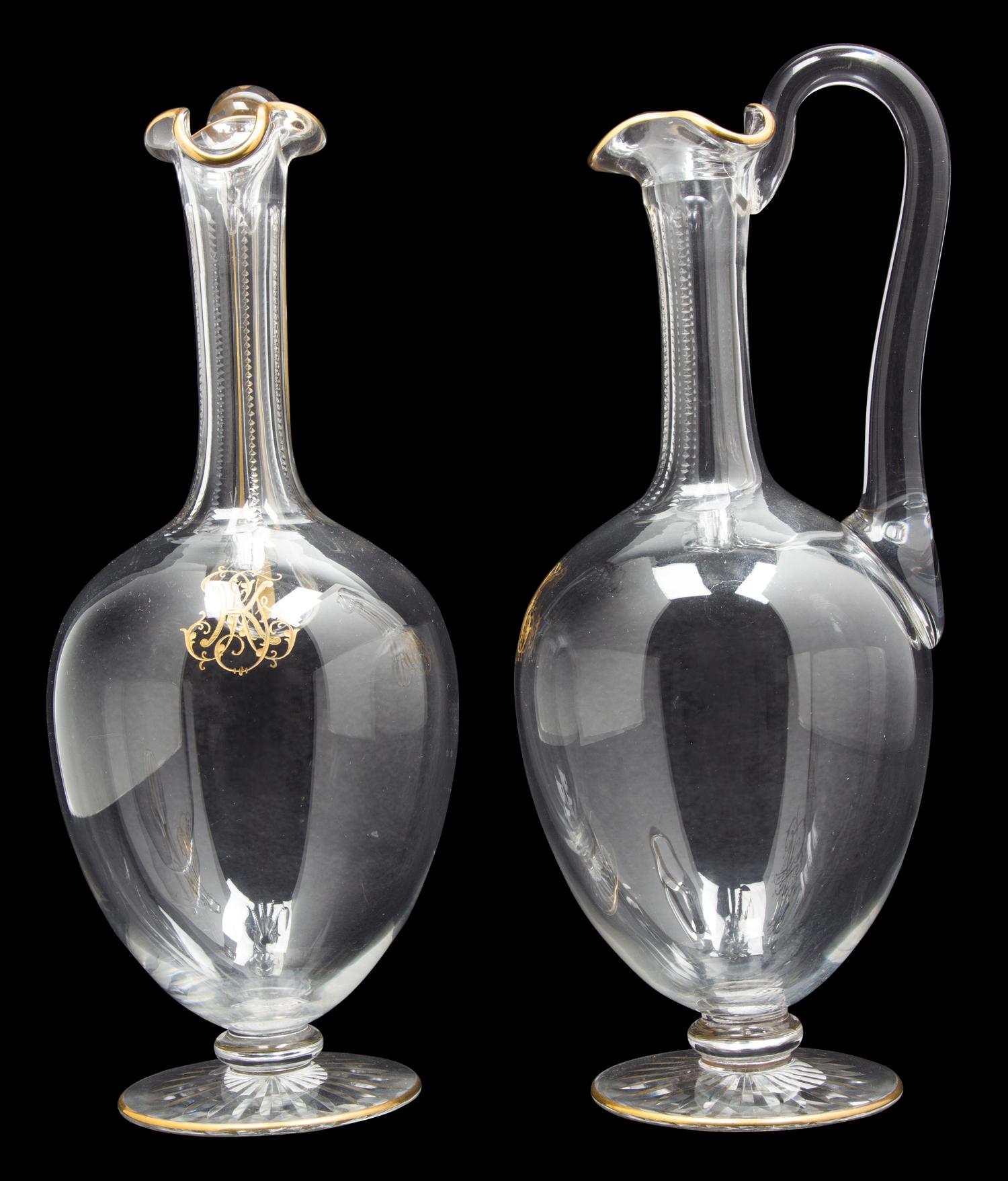 A Pair of Le Rosey Glass Carafes Height 10 1/2 inches.