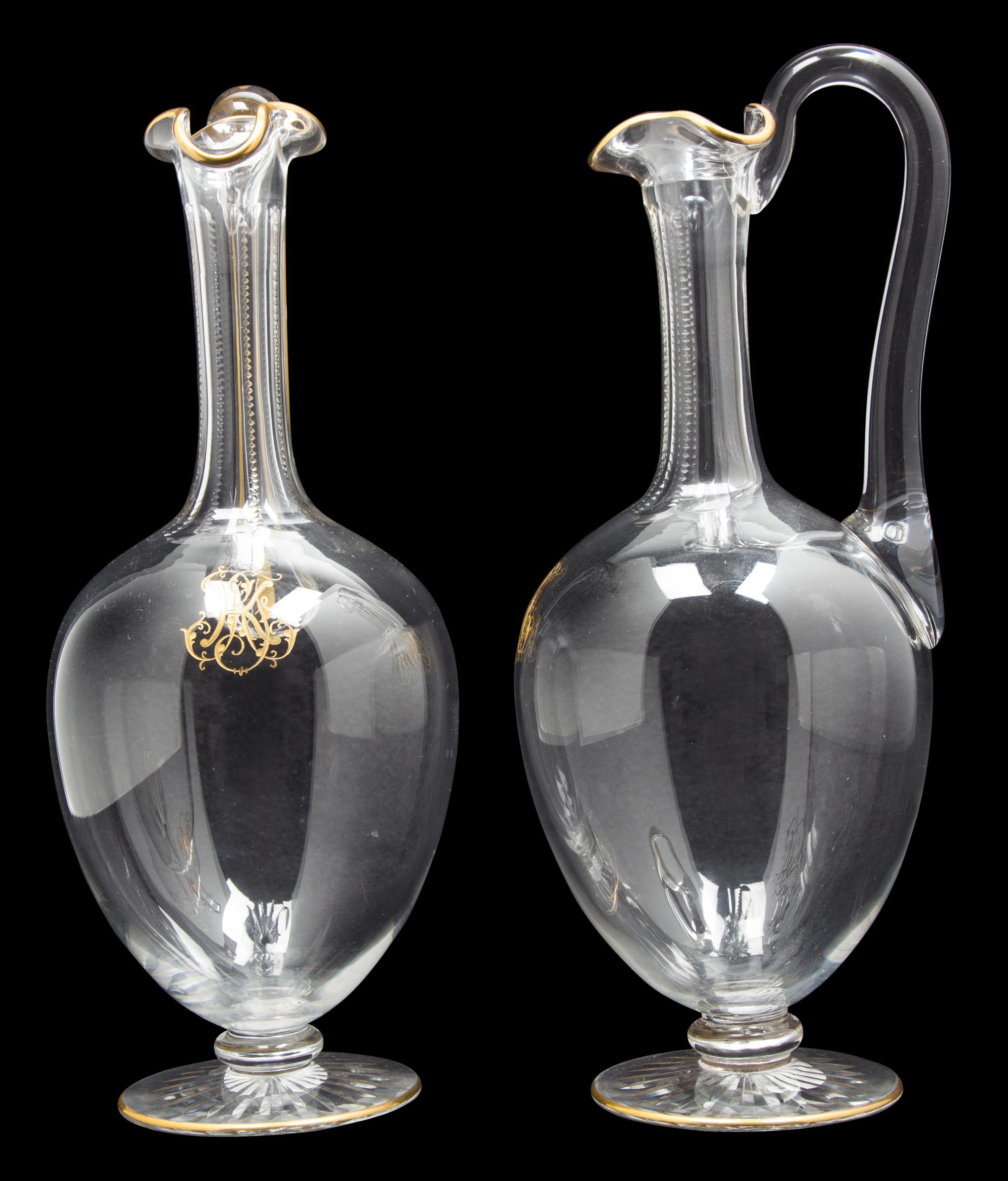 A Pair of Le Rosey Glass Carafes Height 10 1/2 inches.