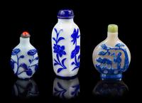 Three Blue Overlay White Peking Glass Snuff Bottles Height of tallest 4 inches. — 20TH CENTURY