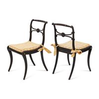 A Suite of Six Regency Ebonized and Caned Dining Chairs