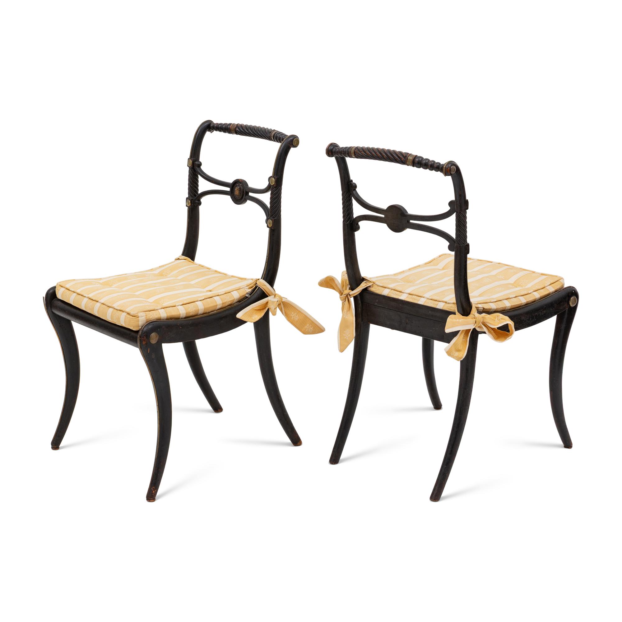A Suite of Six Regency Ebonized and Caned Dining Chairs