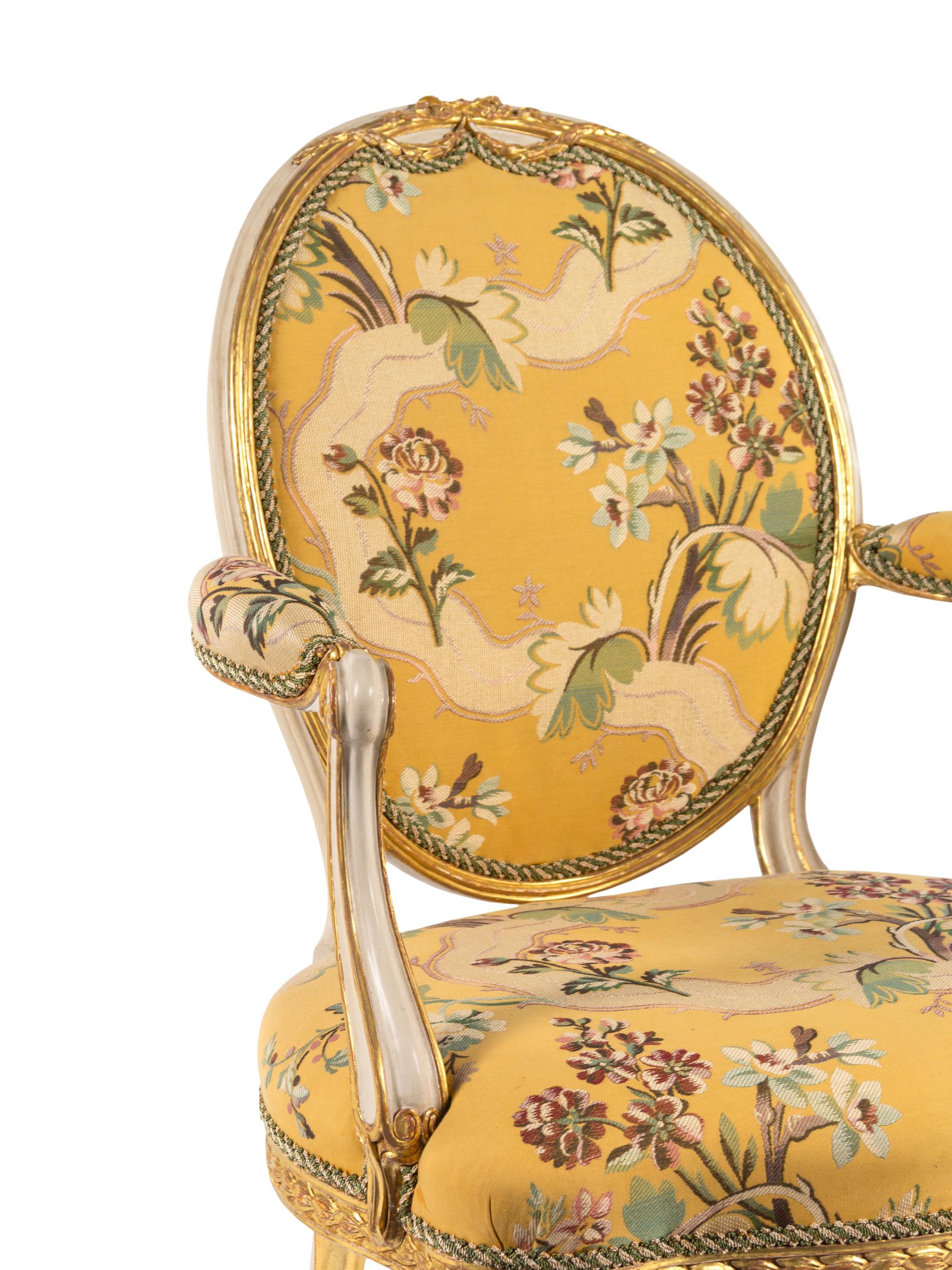 A George III White-Painted and Parcel-Gilt Open Armchair