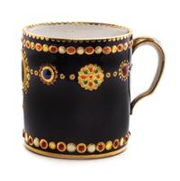 A Sevres Jeweled Porcelain Cup Height 2 3/8 inches. — CIRCA 1786