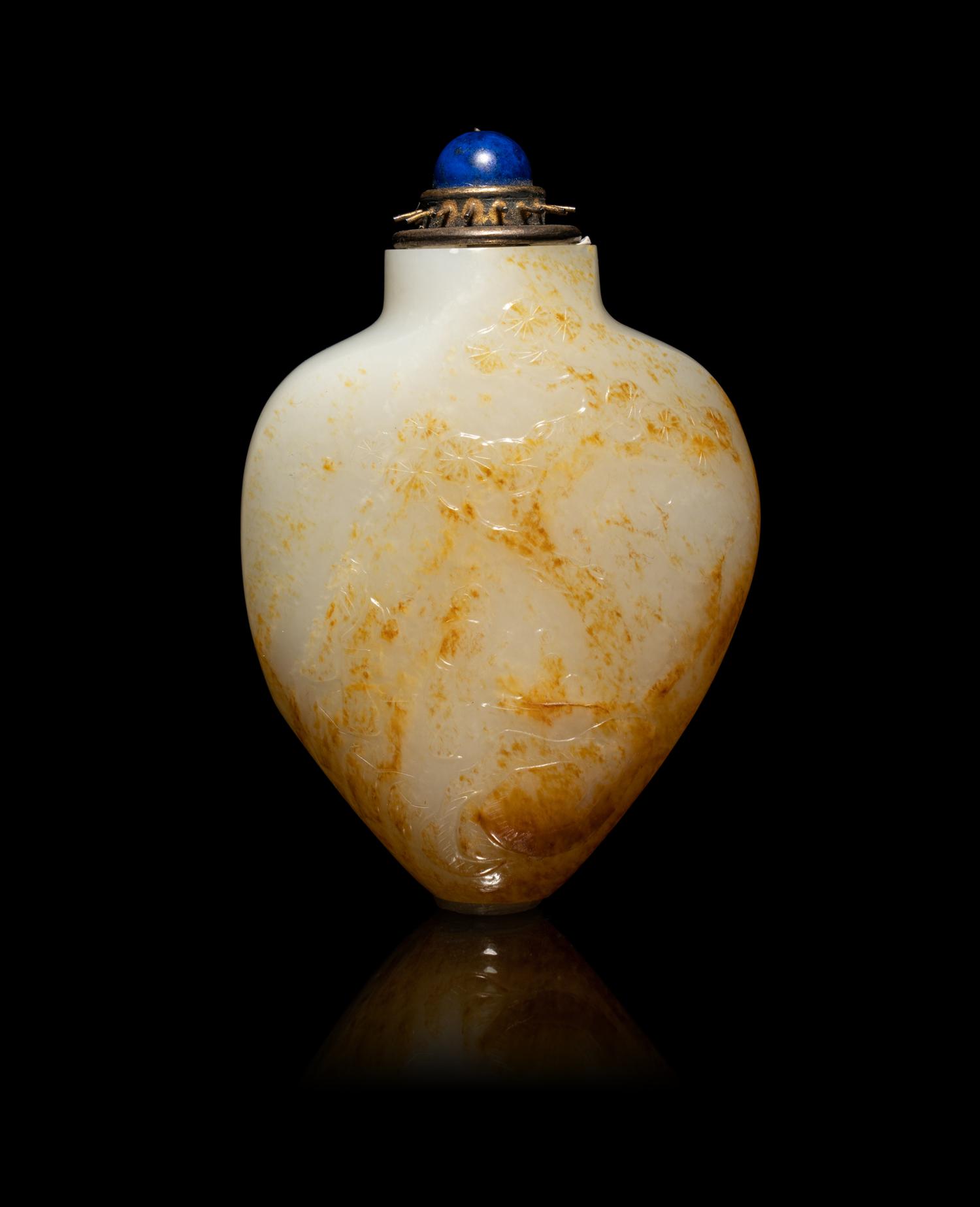 A Chinese Russet and White Jade 'Fishing' Snuff Bottle
