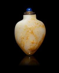 A Chinese Russet and White Jade 'Fishing' Snuff Bottle