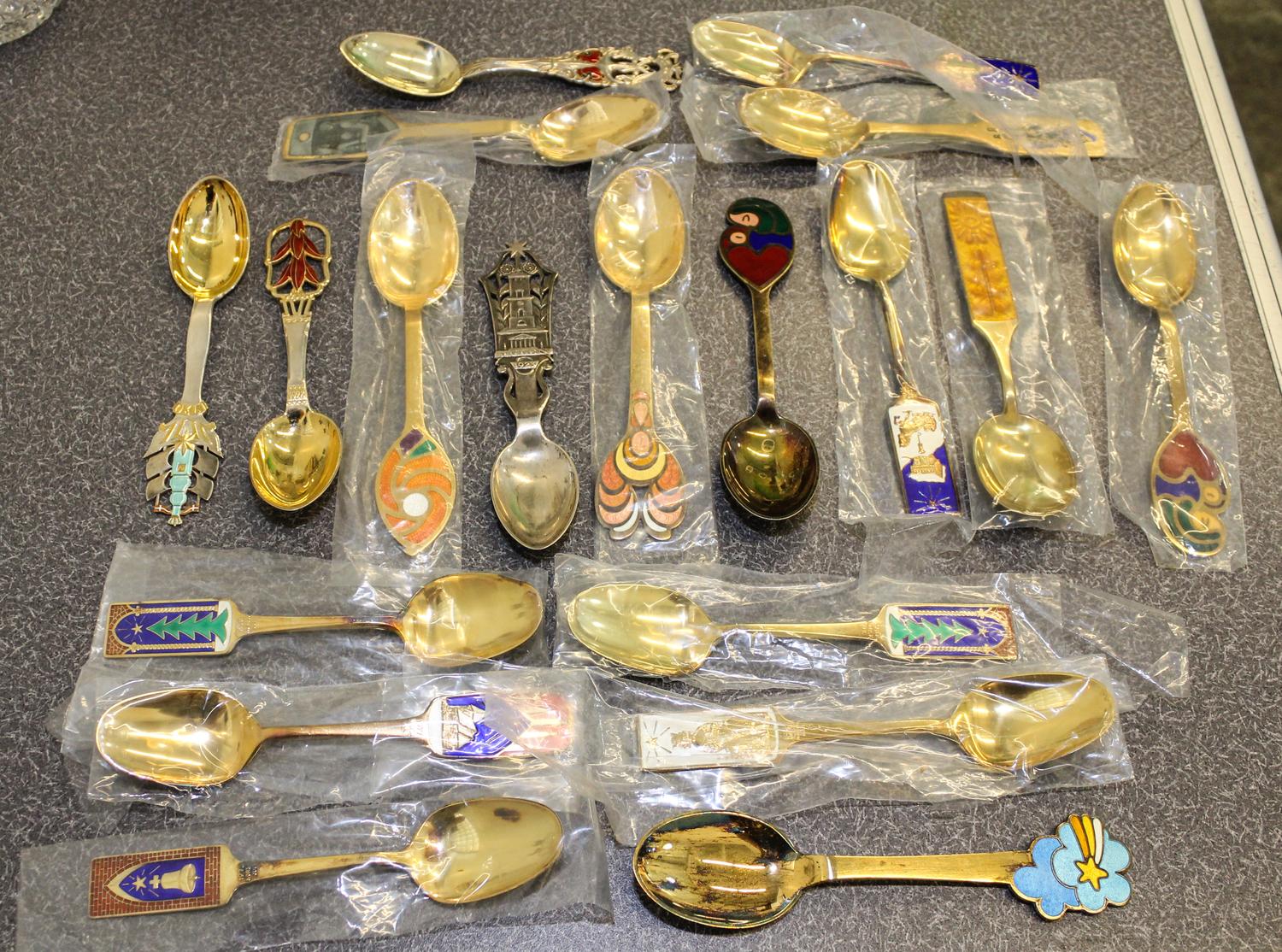 A Group of Eighteen Danish Silver, Gilt and Enamel Christmas Spoons, various makers, comprising examples from: 1923, 1928, 1930, 1966,