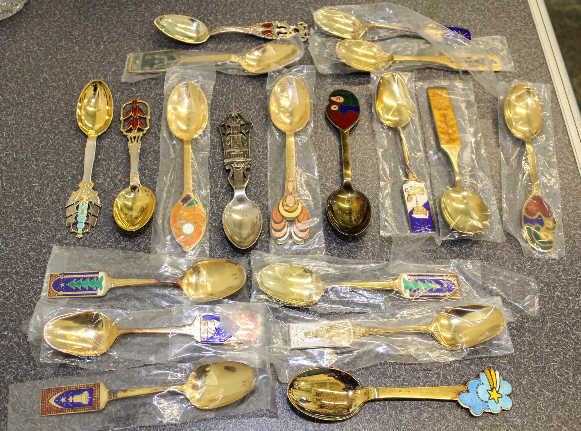A Group of Eighteen Danish Silver, Gilt and Enamel Christmas Spoons, various makers, comprising examples from: 1923, 1928, 1930, 1966,