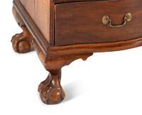 A Chippendale Mahogany and Cherrywood Serpentine Claw-and-Ball Foot Desk-and-Bookcase