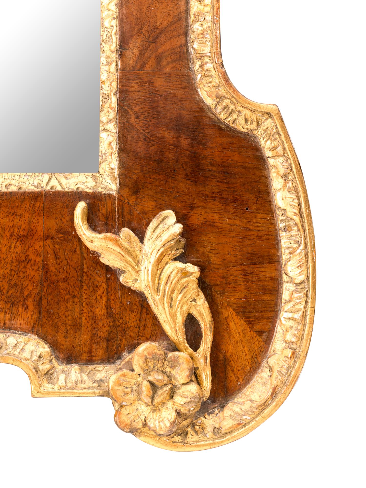 A George II Parcel Gilt Walnut Mirror