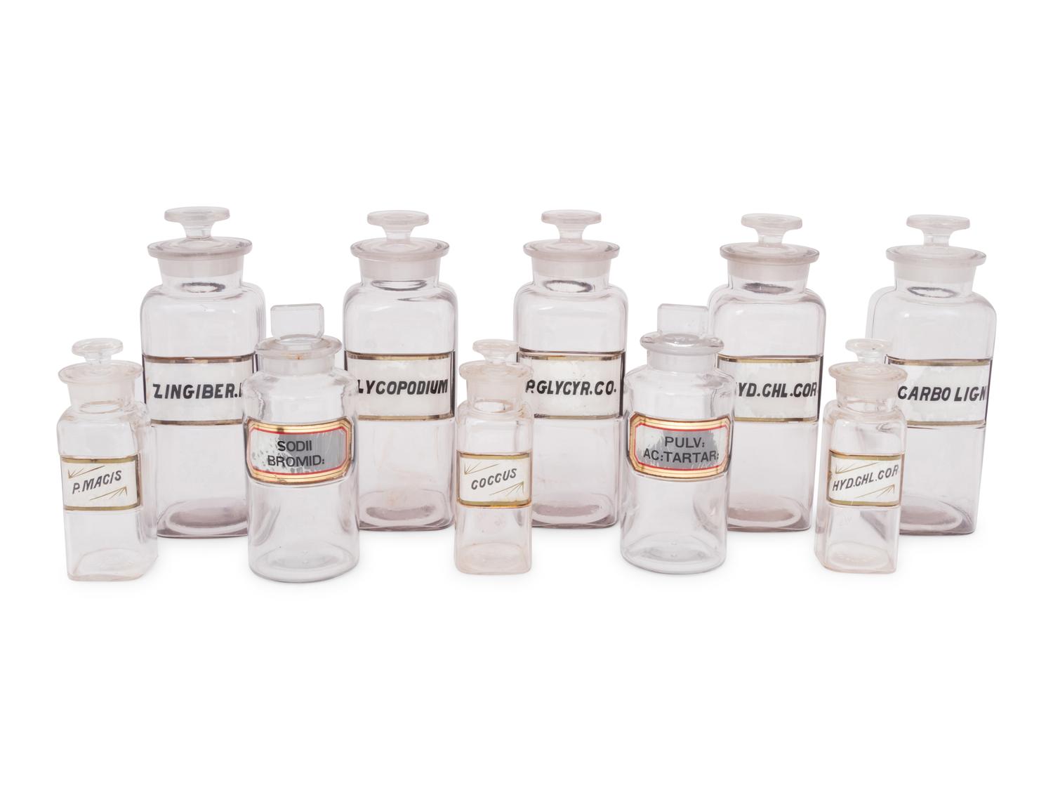 A Collection of Clear Glass Apothecary Jars