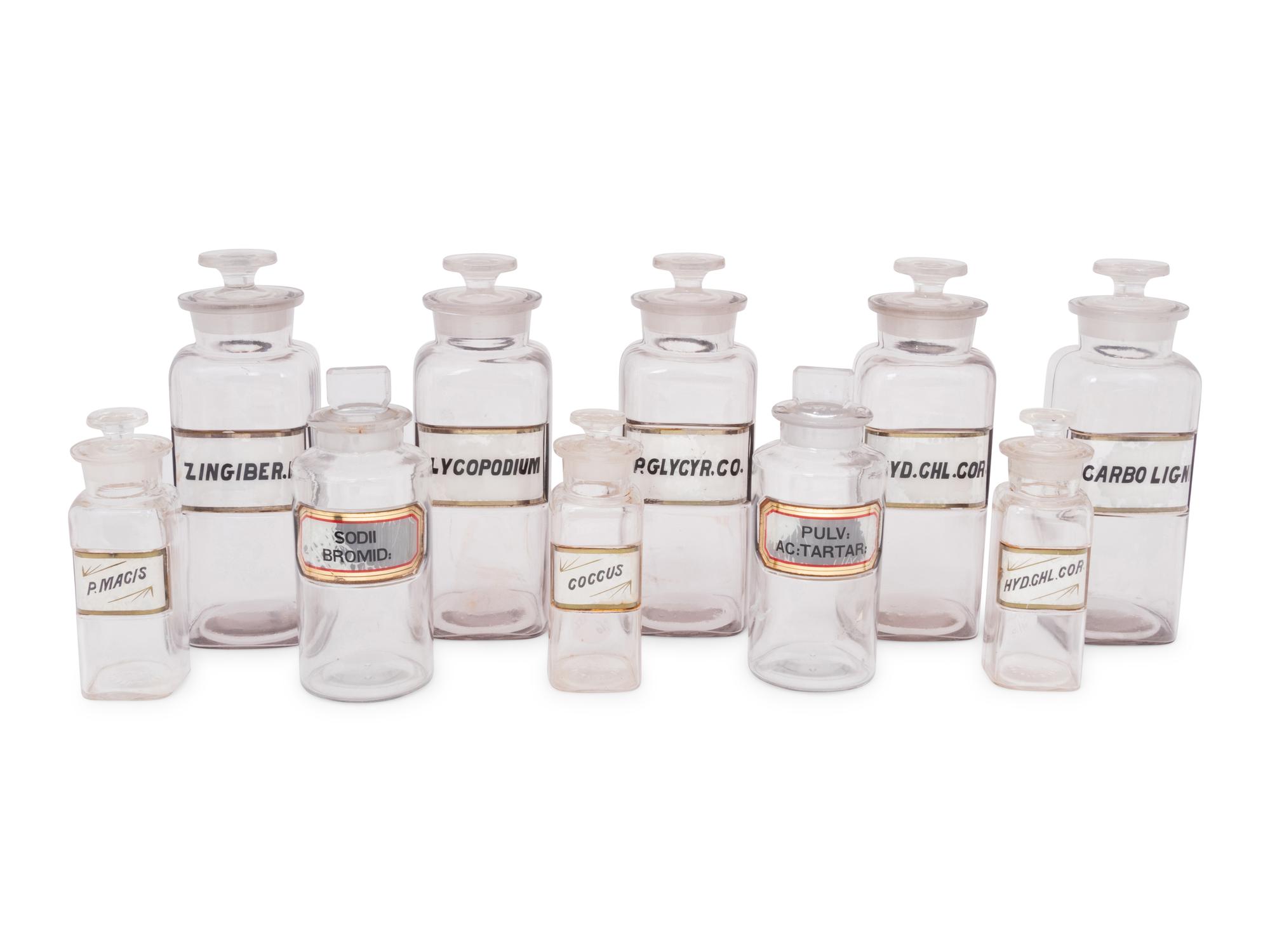 A Collection of Clear Glass Apothecary Jars