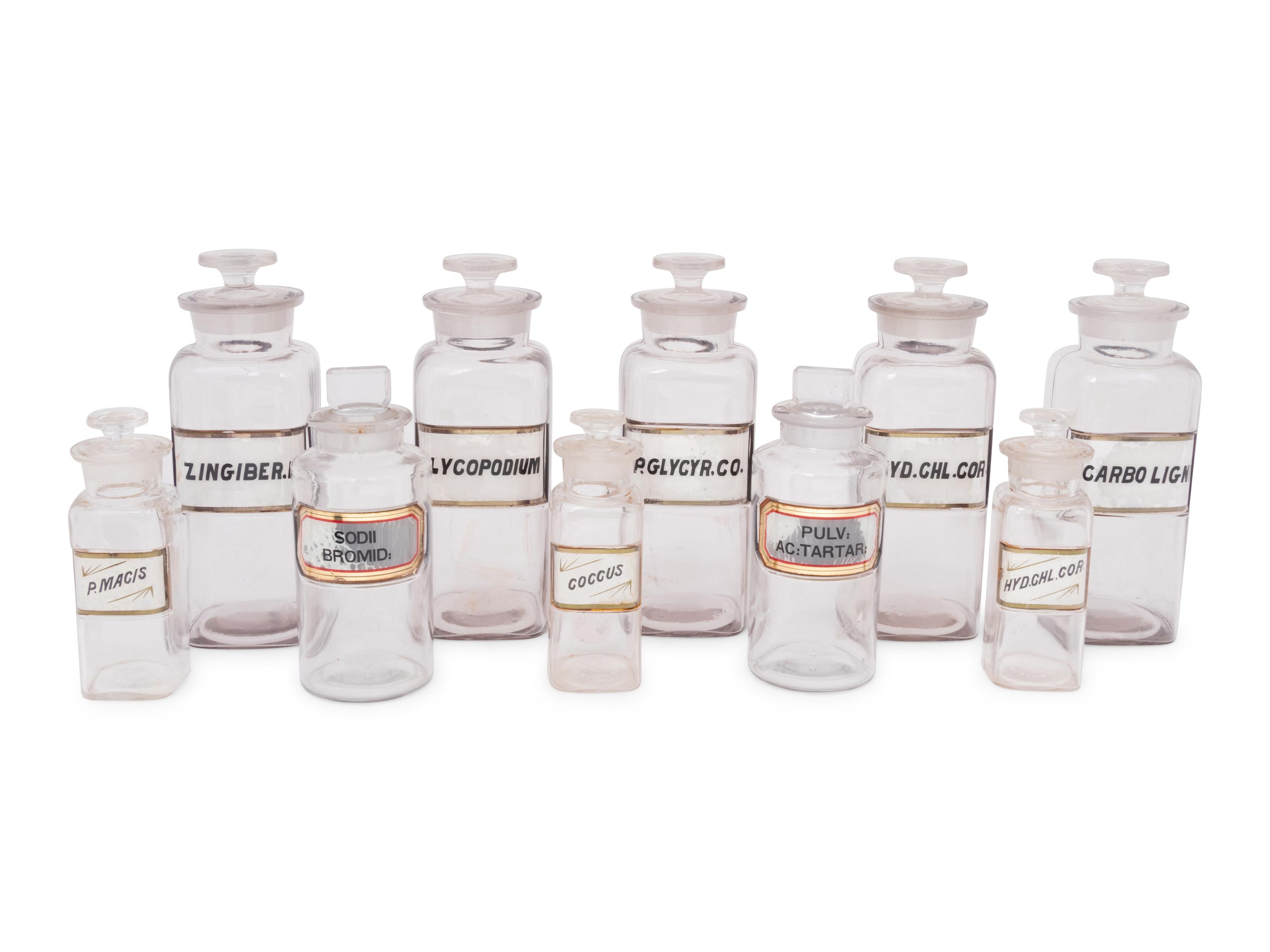 A Collection of Clear Glass Apothecary Jars