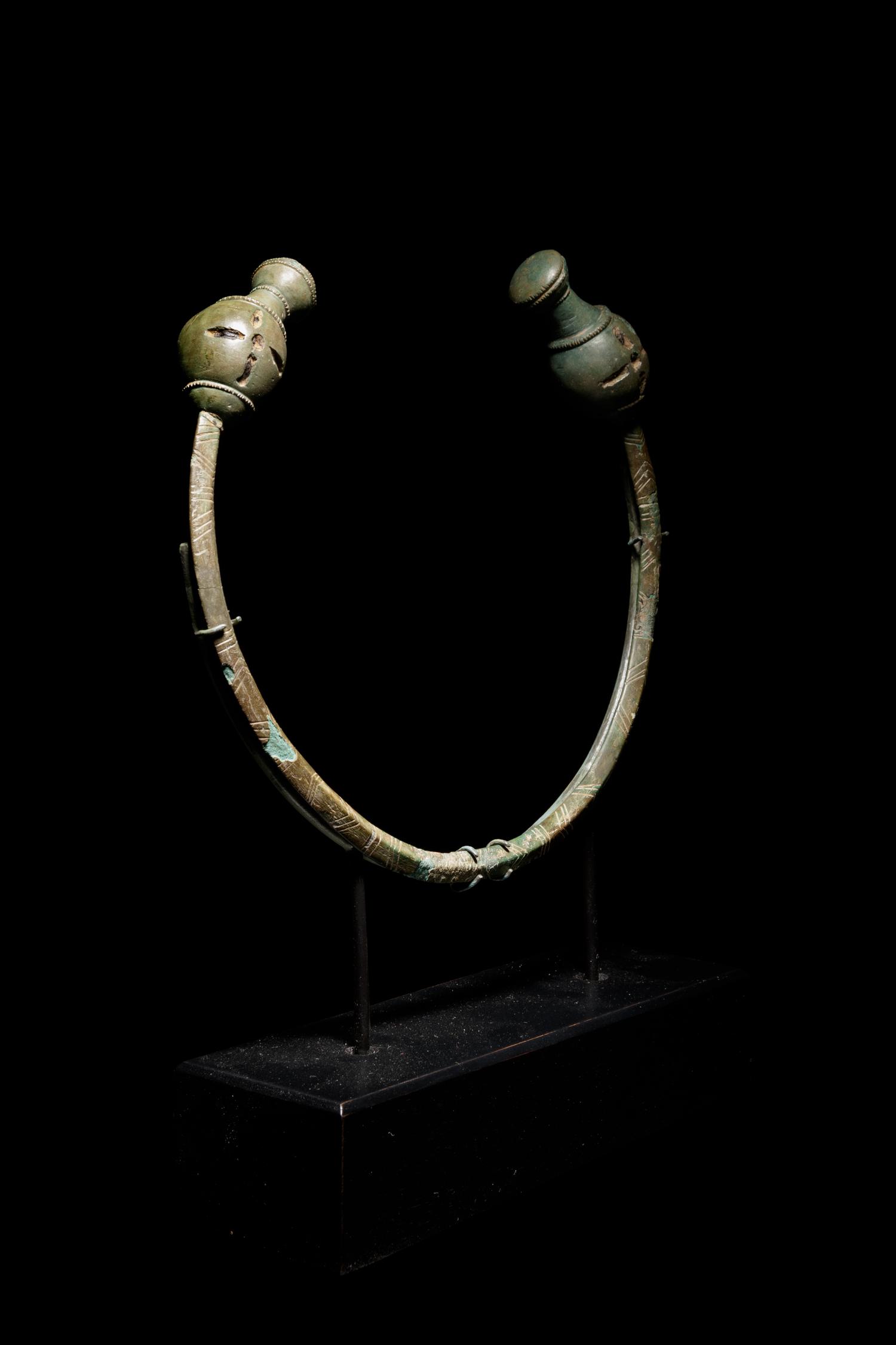 A Celtic Bronze Torc with Poppy-Head Terminals